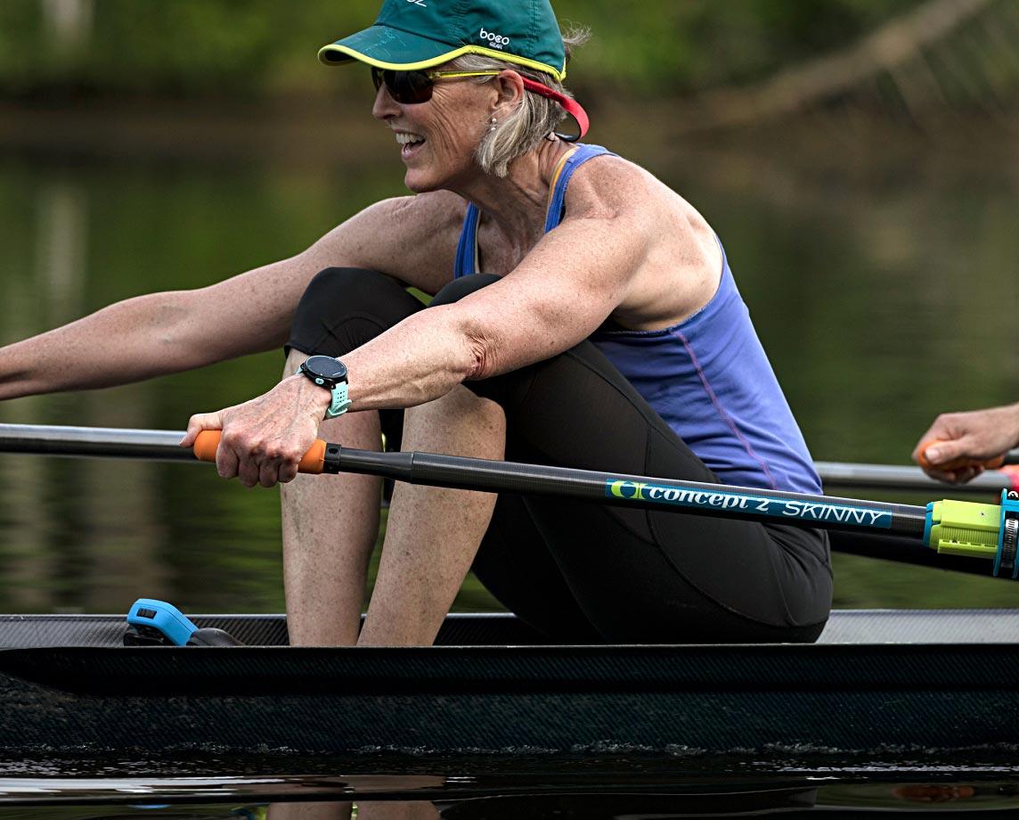 Woman rowing with Concept2 sculls