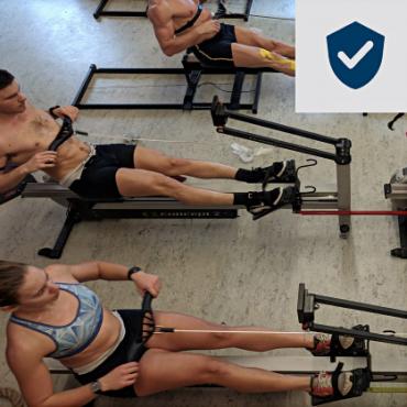 Group of Athletes on Dynamic RowErgs