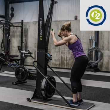 Athlete Using the SkiErg with Stand in a Gym